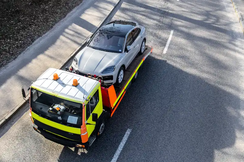 Damaged van being safely loaded onto a tow truck after a road accident as part of 24-hour emergency towing services in Melbourne.